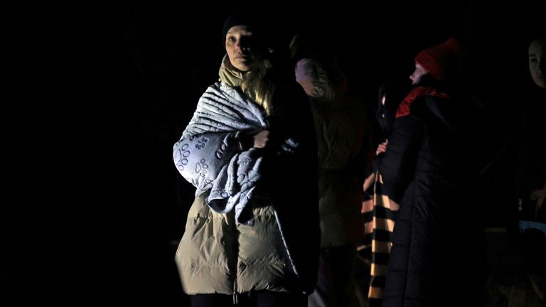 People aim for the Polish border in Lviv Oblast, western Ukraine, near 5 km before the Polish border, on February 27, 2022. Lots of Ukrainians are heading to Poland to escape the war. ( The Yomiuri Shimbun via AP Images )