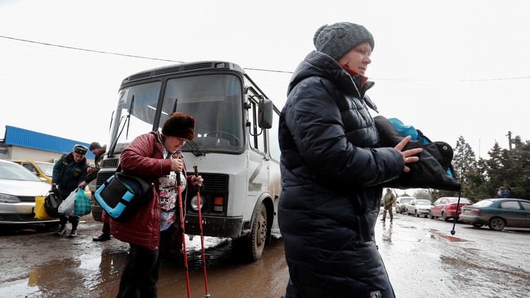 Evacuees from Mariupol area arrive at a refugee camp in the settlement of Bezymennoye, Ukraine March 8, 2022. REUTERS/Alexander Ermochenko