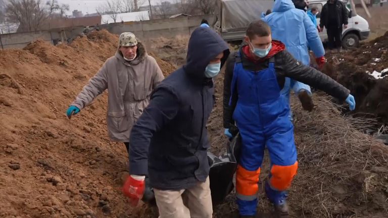 Local authorities in Mariupol hurried to bury the dead from the past two weeks of fighting in a mass grave.