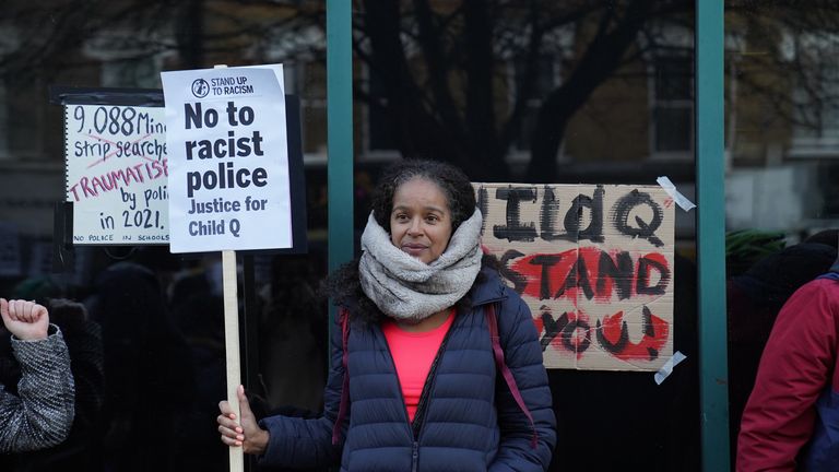 People demonstrate outside Stoke Newington Police Station in London, over the treatment of a black 15-year-old schoolgirl who was strip-searched by police while on her period. The secondary school pupil - referred to as Child Q - has launched civil proceedings against the Metropolitan Police over the search by two female officers, without another adult present, in 2020. Three police officers have been investigated for misconduct by the Independent Office for Police Conduct, which is finalising i