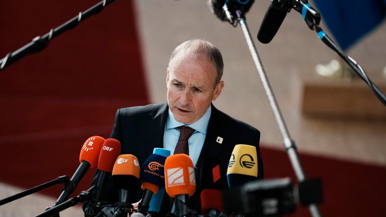 Ireland&#39;s Prime Minister Micheal Martin speaks with the media as he arrives for an EU summit in Brussels, Friday, March 25, 2022. After a first day of talks dedicated to the war in Ukraine, EU leaders turn their focus to energy policy as they try to agree on measures aimed at curbing skyrocketing electricity prices at a summit in Brussels. (AP Photo/Thibault Camus)