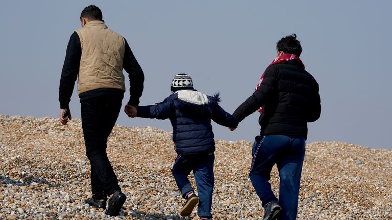 A young child amongst a group of people thought to be migrants after being brought in to Dungeness, Kent, onboard the RNLI Lifeboat following a small boat incident in the Channel. Picture date: Thursday March 24, 2022.