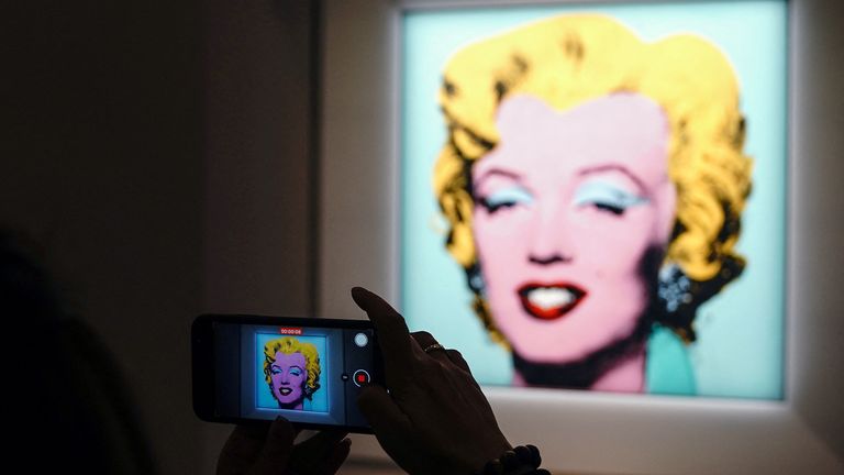 Andy Warhol's "Shot Sage Blue Marilyn", a painting of Marilyn Monroe, is pictured on display at Christie's Auction House in advance of the piece going up for auction in the Manhattan borough of New York City, New York, U.S., March 21, 202
