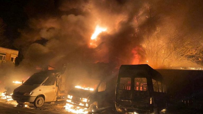 Cars and buildings are seen on fire after shelling, as Russia&#39;s invasion of Ukraine continues, in Mykolaiv, Ukraine, in this handout picture released March 23, 2022. Press service of the State Emergency Service of Ukraine/Handout via REUTERS ATTENTION EDITORS - THIS IMAGE HAS BEEN SUPPLIED BY A THIRD PARTY.
