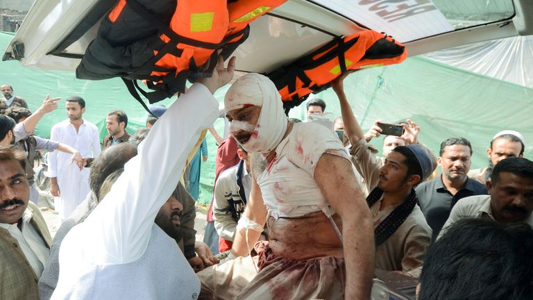 People move an injured in an ambulance, after a bomb blast in a mosque during Friday prayers, at a hospital in Peshawar, Pakistan, March 4, 2022. REUTERS/Khuram Parvez
