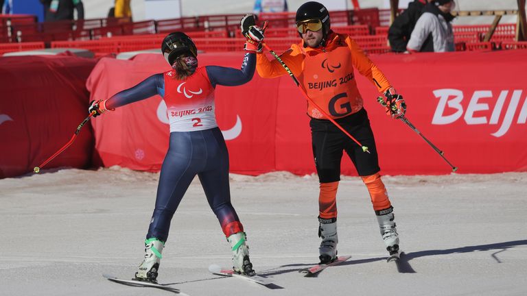 Millie and her guide Brett Wild react after competing the Women&#39;s Downhill Sitting