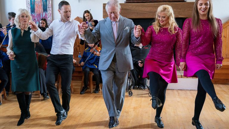 Britain&#39;s Prince Charles and Camilla, Duchess of Cornwall join in with the dancers during their visit at the Bru Boru Cultural Centre in Tipperary, Ireland March 25, 2022. Arthur Edwards/Pool via REUTERS
