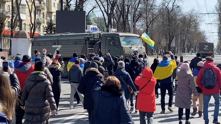 Protesters confront Russian military vehicles in Kherson