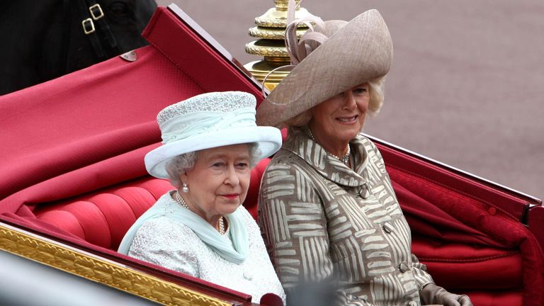 Queen Elizabeth II and the Duchess of Cornwall travel in a carriage to Buckingham Palace along The Mall, London in 2012