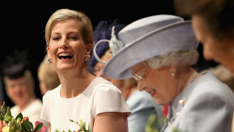 Sophie, Countess of Wessex, Princess Anne, Princess Royal and Queen Elizabeth II laugh during the National Federation of Women's 100th Anniversary Annual Meeting in 2015