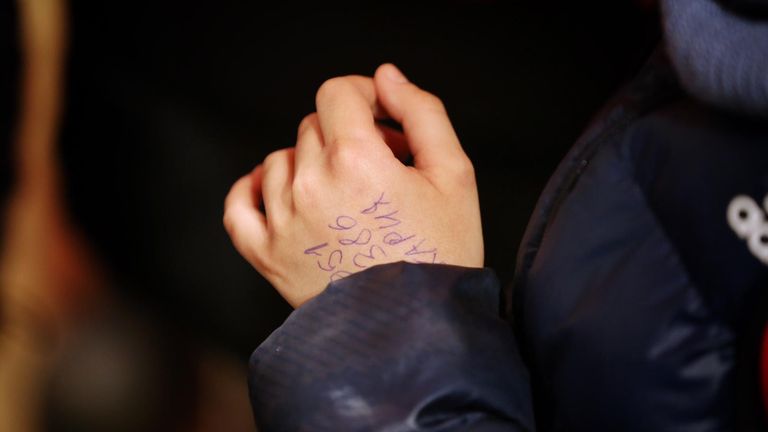 A phone number written on the hand of an 11-year-old Ukrainian refugee who travelled 600 miles across Ukraine to the Slovakian border by himself and was later reunited with his relatives. Pic: Ministerstvo vnútra SR