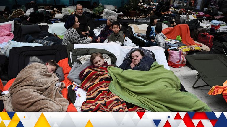 uPeople lie on camp beds at a refugee reception center, as Russia&#39;s invasion of Ukraine continues, at the Ukrainian-Polish border crossing in Korczowa, Poland March 5, 2022. Olivier Douliery/Pool via REUTERS
