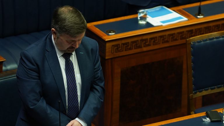 Robin Swann takes part in minute's silence in the Northern Ireland Assembly chamber at Stormont before the delivery of the long-awaited public apology to the victims of historical institutional abuse. The public apology was recommended in the final report of the Historical Institutional Abuse Inquiry (HIAI), which was published more than five years ago. Picture date: Friday March 11, 2022.
