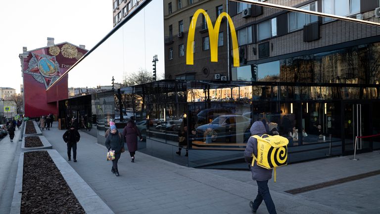 People walk past a McDonald&#39;s restaurant in the main street in Moscow, Russia, Wednesday, March 9, 2022. (AP Photo)


