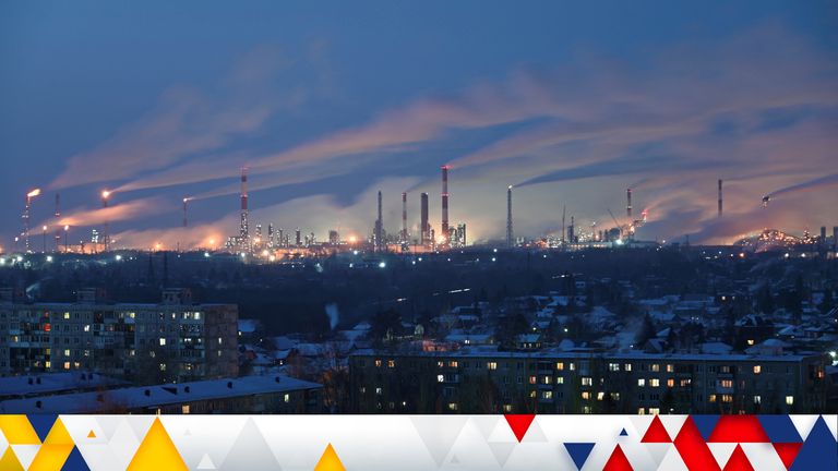 A general view shows a local oil refinery behind residential buildings in Omsk, Russia