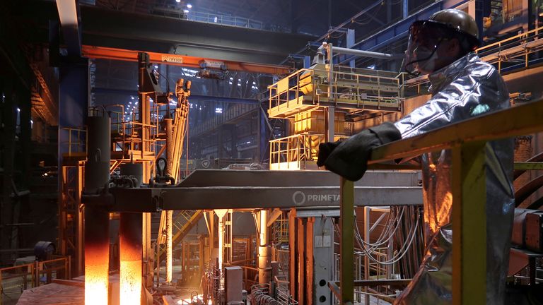 An employee stands near a ladle furnace for adding other components to raw steel at the plant of steelmaker Severstal in Cherepovets, Russia October 22, 2018
