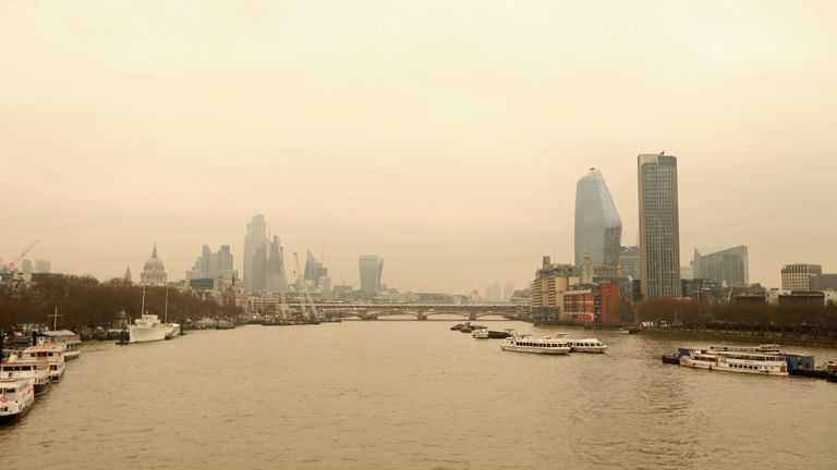 A Saharan dust cloud seen from Waterloo Bridge in London. It comes as parts of southern Spain have been blanketed following a thick plume which has turned skies orange, with satellite images clearly showing the dust over France. Picture date: Wednesday March 16, 2022.
