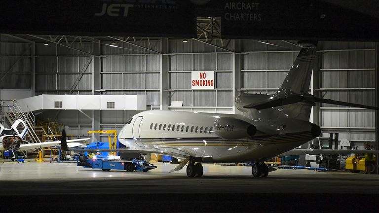 A private jet carrying the coffin of the Australian cricketer arrived at Essendon Airport in Melbourne today. Pic: AP 