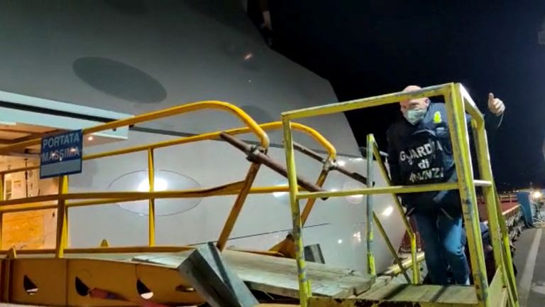 An Italian officer boards Melnichenko&#39;s superyacht