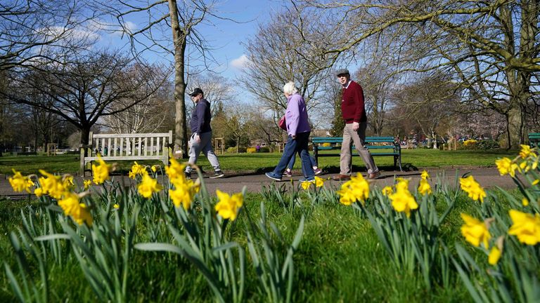 People walk past daffodils in St Nicholas&#39; Park, Warwick