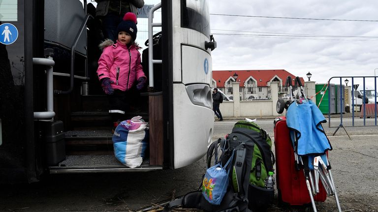 Two-year-old Emiliia Rybak on a bus bound for Italy after fleeing Ukraine for Romania
