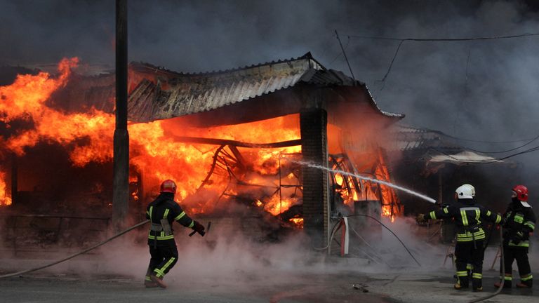 Crews battle a fire at the Barabashova market in Kharkiv, Ukraine