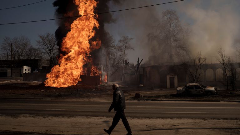 A man walks past flames and smoke rising from a fire following a Russian attack in Kharkiv, Ukraine, Friday, March 25, 2022. (AP Photo/Felipe Dana)
PIC:AP
