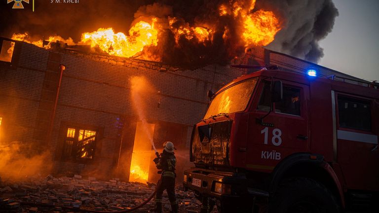 Buildings set ablaze by Russian shelling in Kyiv