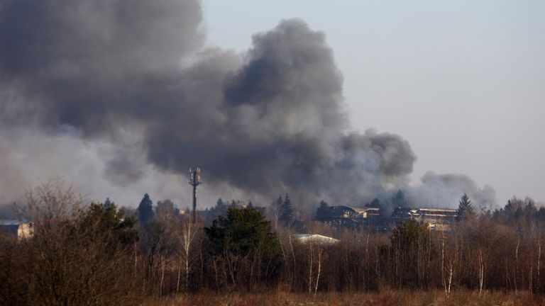 Smoke rises from a building near Lviv airport, Ukraine.