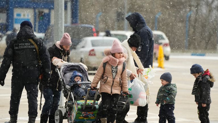 Moldova border guards check refugees fleeing the war from neighbouring Ukraine, at the border crossing in Palanca, Moldova, Friday, March 11, 2022. (AP Photo/Sergei Grits)
PIC:AP

