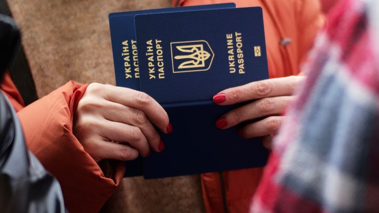 A woman holds Ukrainian passports as she waits to register for a bus which will take refugees to Germany, at the train station in Przemysl, Poland, Thursday, March 3, 2022. More than 1 million people have fled Ukraine following Russia&#39;s invasion in the swiftest refugee exodus in this century, the United Nations said Thursday. (AP Photo/Markus Schreiber)
PIC:AP
