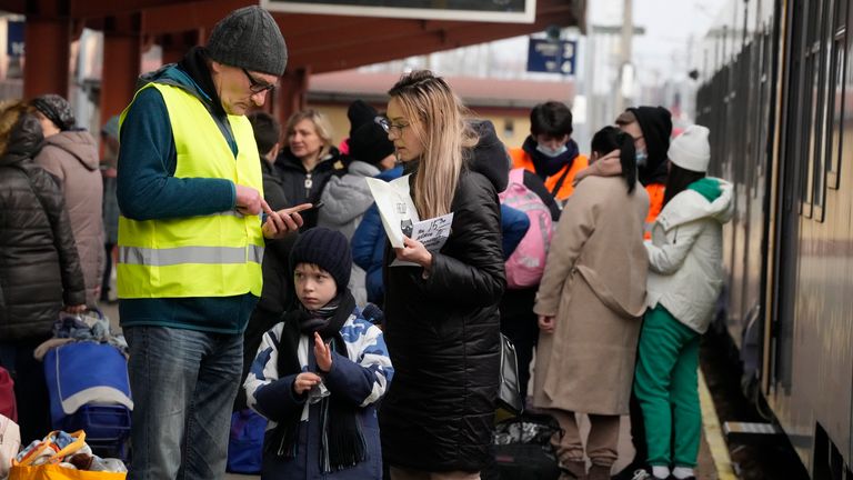 A man helps a woman and a child on the platform after a train arrived from Ukraine, in Przemysl, Poland, Thursday, March 3, 2022. More than 1 million people have fled Ukraine following Russia&#39;s invasion in the swiftest refugee exodus in this century, the United Nations said Thursday. (AP Photo/Czarek Sokolowski)
PIC:AP