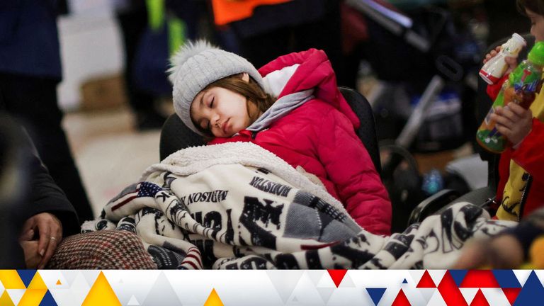 A child fleeing from Ukraine sleeping inside a temporary shelter in Romania