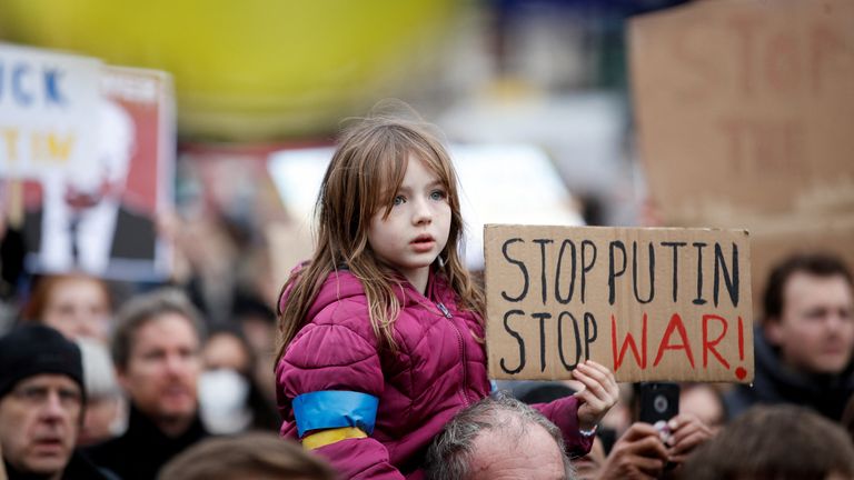 Flags and signs were held as crowds gathered to show solidarity to Ukraine