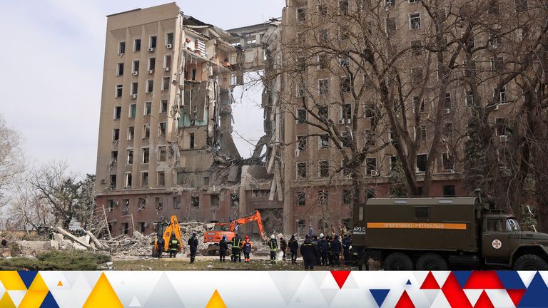 Rescuers work at the site of a destroyed Ukrainian government administration building following a bombing, as Russia&#39;s invasion of Ukraine continues, in Mykolaiv, Ukraine, March 29, 2022. REUTERS/Nacho Doce