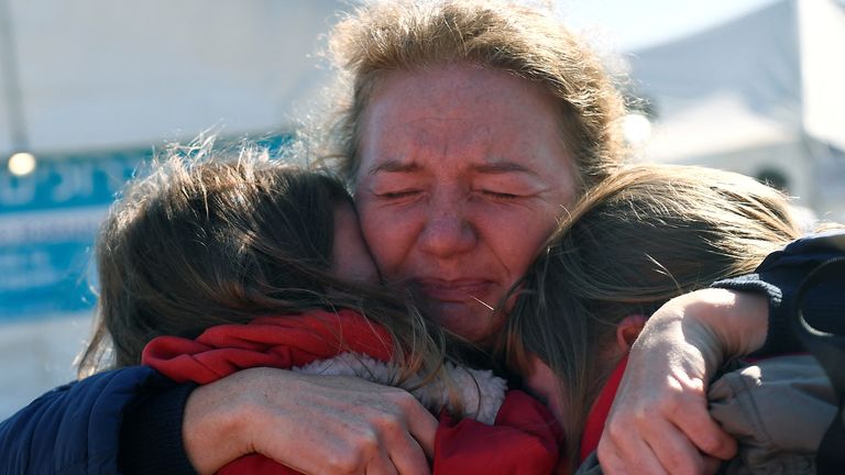 Women from Kharkiv are reunited with their friend from Chernihiv in Ukraine after fleeing to Romania, following Russia&#39;s invasion of Ukraine, at the border crossing in Siret, Romania, March 22, 2022. REUTERS/Clodagh Kilcoyne