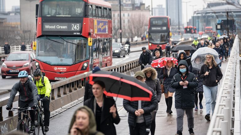 Commuters cross Waterloo Bridge in London, as tube services remain disrupted following a strike