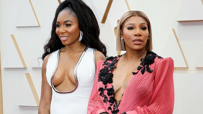 Professional tennis players Venus and Serena Williams pose on the red carpet during the Oscars arrivals at the 94th Academy Awards in Hollywood, Los Angeles, California, U.S., March 27, 2022. REUTERS/Eric Gaillard
