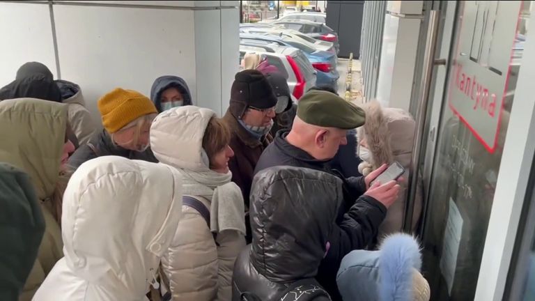 People queue for UK visas