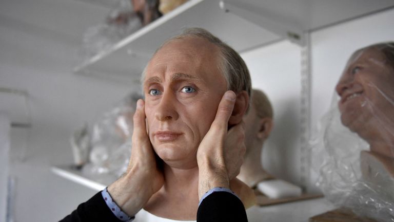 TOPSHOT - A staff member of the Grevin museum packs a wax statue of Russian President Vladimir Putin before it is stored in the reseve, as a reaction to Russia&#39;s invasion of Ukraine on March 1, 2022 at the Grevin museum in Paris. (Photo by JULIEN DE ROSA / AFP) (Photo by JULIEN DE ROSA/AFP via Getty Images)
