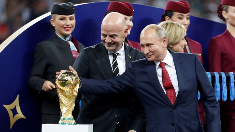 FILE PHOTO: Soccer Football - World Cup - Final - France v Croatia - Luzhniki Stadium, Moscow, Russia - July 15, 2018 FIFA president Gianni Infantino and President of Russia Vladimir Putin with the World Cup trophy before the medals ceremony REUTERS/Damir Sagolj/File Photo