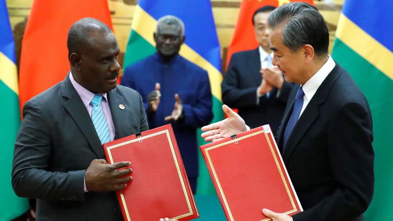 Chinese State Councillor and Foreign Minister Wang Yi and Solomon Islands Foreign Minister Jeremiah Manele attend a signing ceremony in 2019