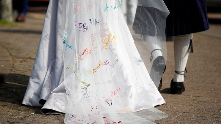 A view shows a detail of the wedding dress worn by Stella Moris, partner of WikiLeaks founder Julian Assange, as she arrives at HMP Belmarsh prison before her wedding to Assange, in London, Britain, March 23, 2022. REUTERS/Peter Nicholls
