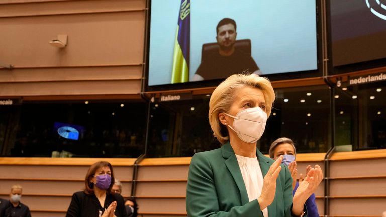 European Commission President Ursula von der Leyen applauds after an address by Ukraine&#39;s President Volodymyr Zelenskyy, via video link, during an extraordinary session on Ukraine at the European Parliament in Brussels, Tuesday, March 1, 2022. The European Union&#39;s legislature meets in an extraordinary session to assess the war in Ukraine and condemn the invasion of Russia. EU Commission President Ursula von der Leyen and Council President Charles Michel will be among the speakers. (AP Photo/Virg