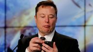 FILE PHOTO: SpaceX founder and chief engineer Elon Musk looks at his mobile phone during a post-launch news conference to discuss the SpaceX Crew Dragon astronaut capsule in-flight abort test at the Kennedy Space Center in Cape Canaveral, Florida, U.S. January 19, 2020. REUTERS/Joe Skipper/File Photo 