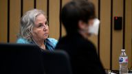 Nancy Crampton Brophy, left, accused of killing her husband Dan Brophy in June of 2018, listens to her trial with the help of headphones in Portland, Ore., Tuesday, April 5, 2022. The trial of the self-published romance writer accused of fatally shooting her chef husband started Monday. She has remained in custody since her arrest in September 2018, facing a murder charge in the death of Daniel Brophy, 63, The Oregonian/OregonLive reported. The trial is expected to last seven weeks. PIC:AP