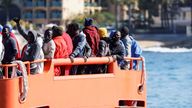 
Migrants wait to disembark from a Spanish coast guard vessel, in the port of Arguineguin, in the island of Gran Canaria, Spain, April 26, 2022. REUTERS/Borja Suarez
