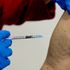A 87-year-old man gets his booster shot at the vaccination center in Frankfurt, Germany, Thursday, Nov. 11, 2021. Germany...s national disease control center has reported a record-high number of more than 50,000 daily coronavirus cases. The infections spike comes as German lawmakers are mulling new legislation that would pave the way for new coronavirus measures. (AP Photo/Michael Probst)