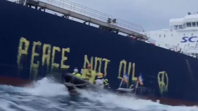 Activists from Greenpeace Italy wrote the message &#39;Peace, not oil&#39; in large letters, on the side of a Russian crude oil tanker, as part of efforts to urge European governments to stop using fossil fuels.