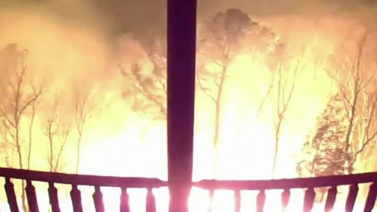 A cabin owner in Tennessee shared the CCTV footage from her cabin showing a bushfire closing in on her home. 